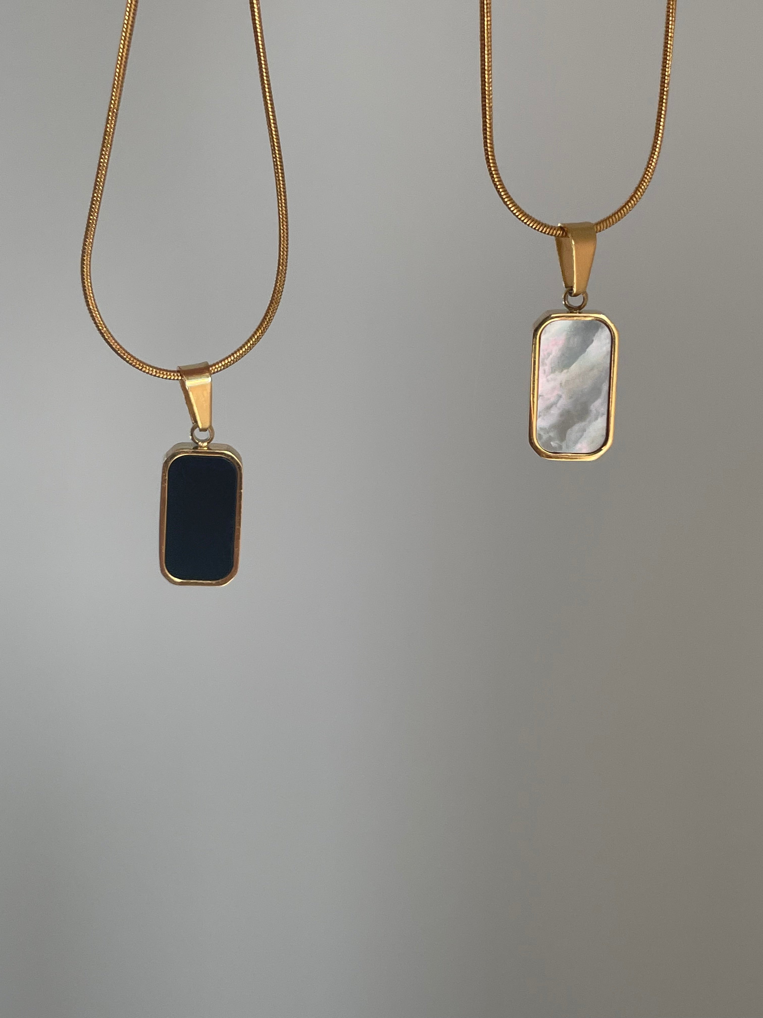 Golden Glow: Enhance Your Look with a Double Sided Pendant Necklace