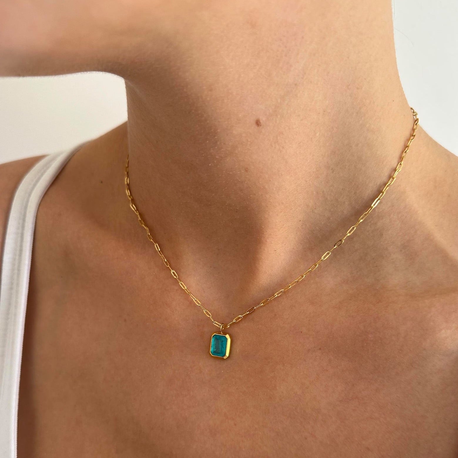 Elegant Blue Pendant Gold Paperclip Chain Necklace with sky-blue charm.