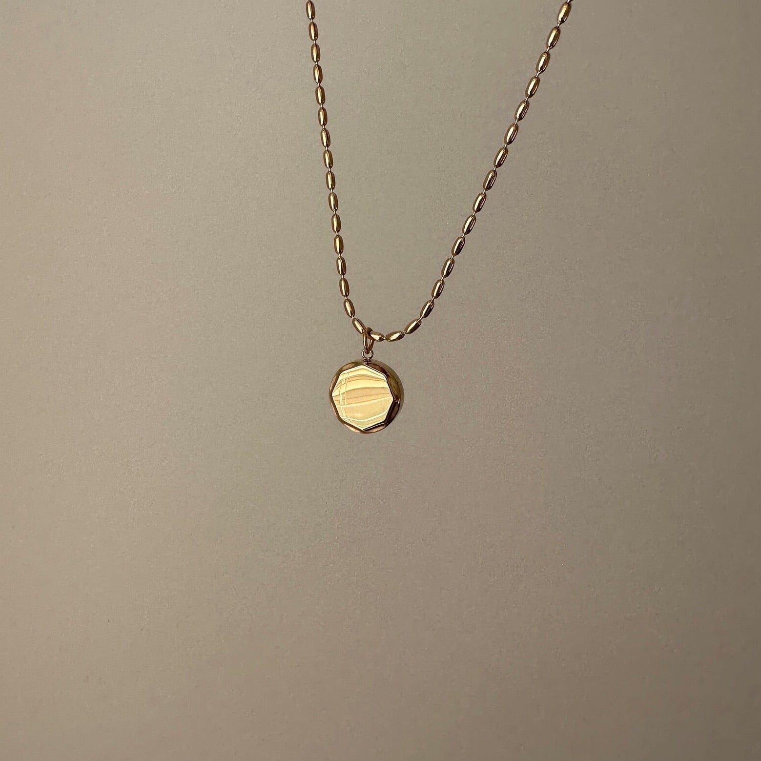 Gold coin pendant necklace