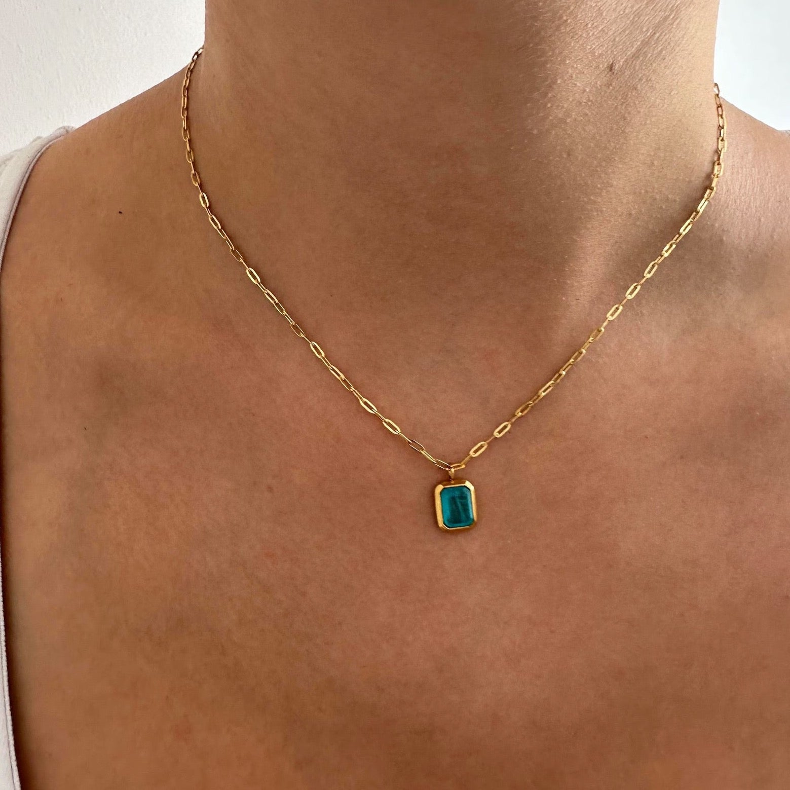 Sophisticated Blue Pendant Gold Paperclip Chain Necklace with a sky-blue pendant.