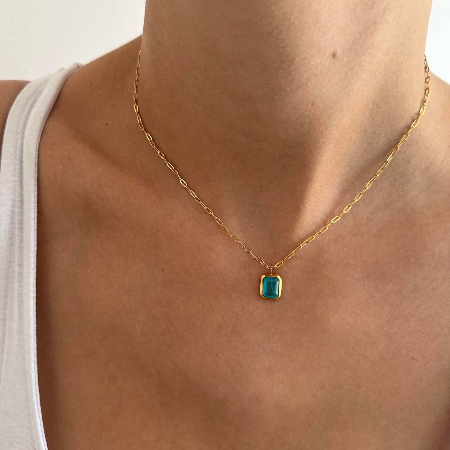 Sky-blue Blue Pendant Gold Paperclip Chain Necklace on a trendy gold chain.