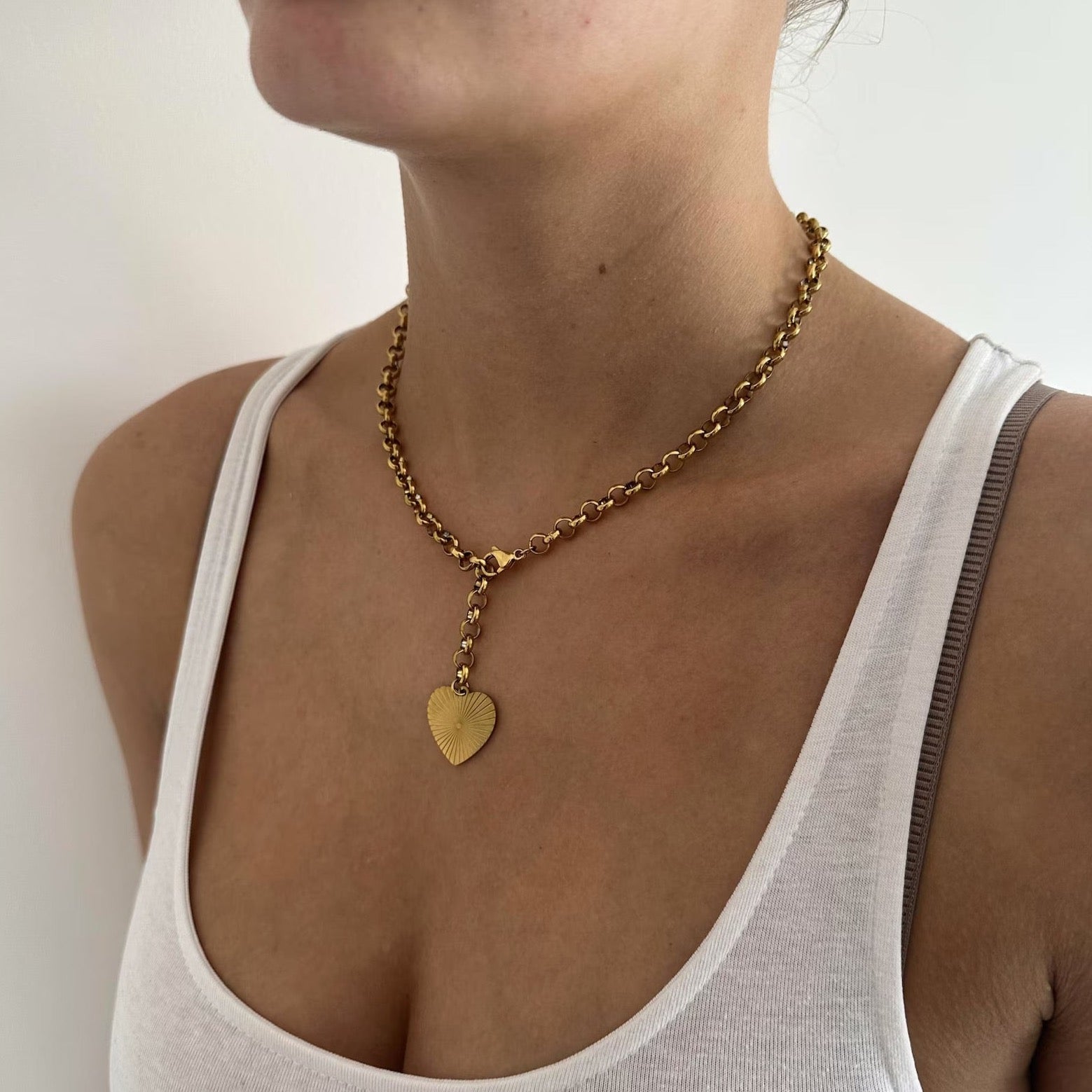 Gleaming golden heart necklace making a statement