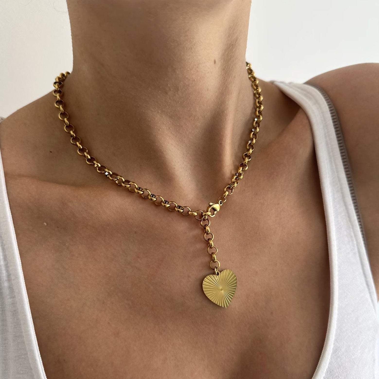 Golden heart necklace gleaming on a delicate chain