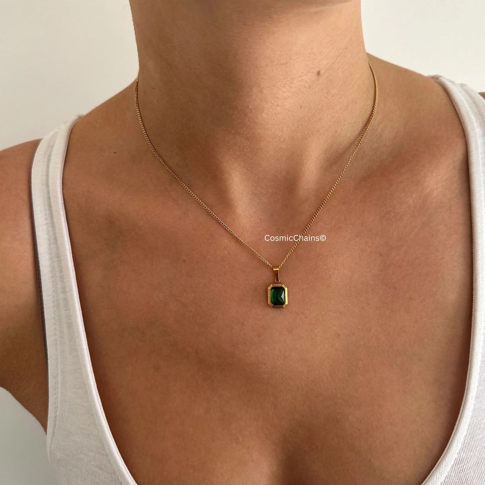 Water-safe Gold and Emerald Necklace, vintage elegance.