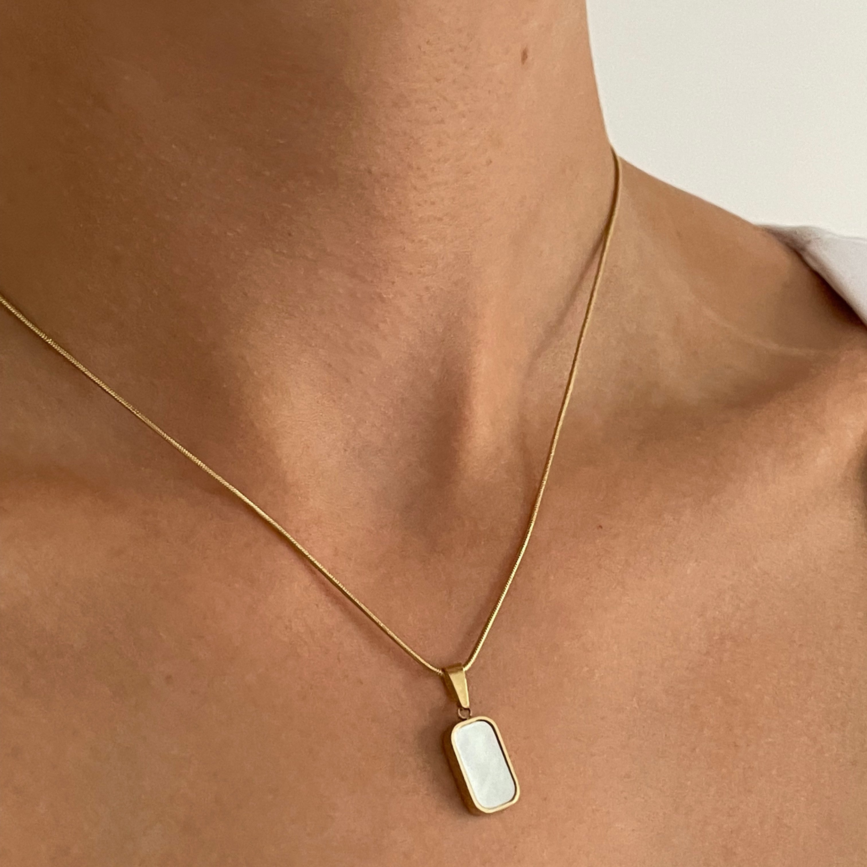Shine Bright with a Gold Necklace Pendant Duo
