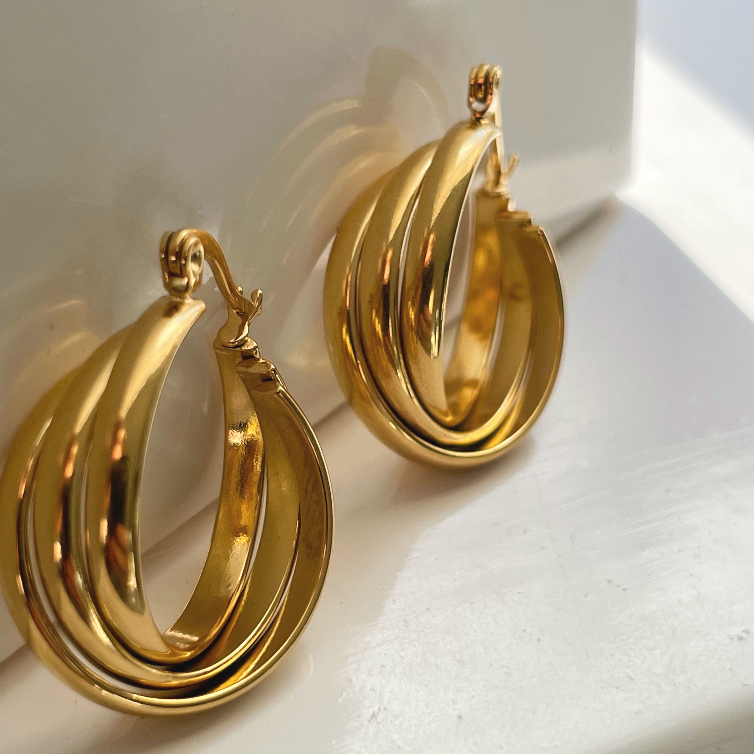 Unique design of Golden Twirl Gold Twist Hoops