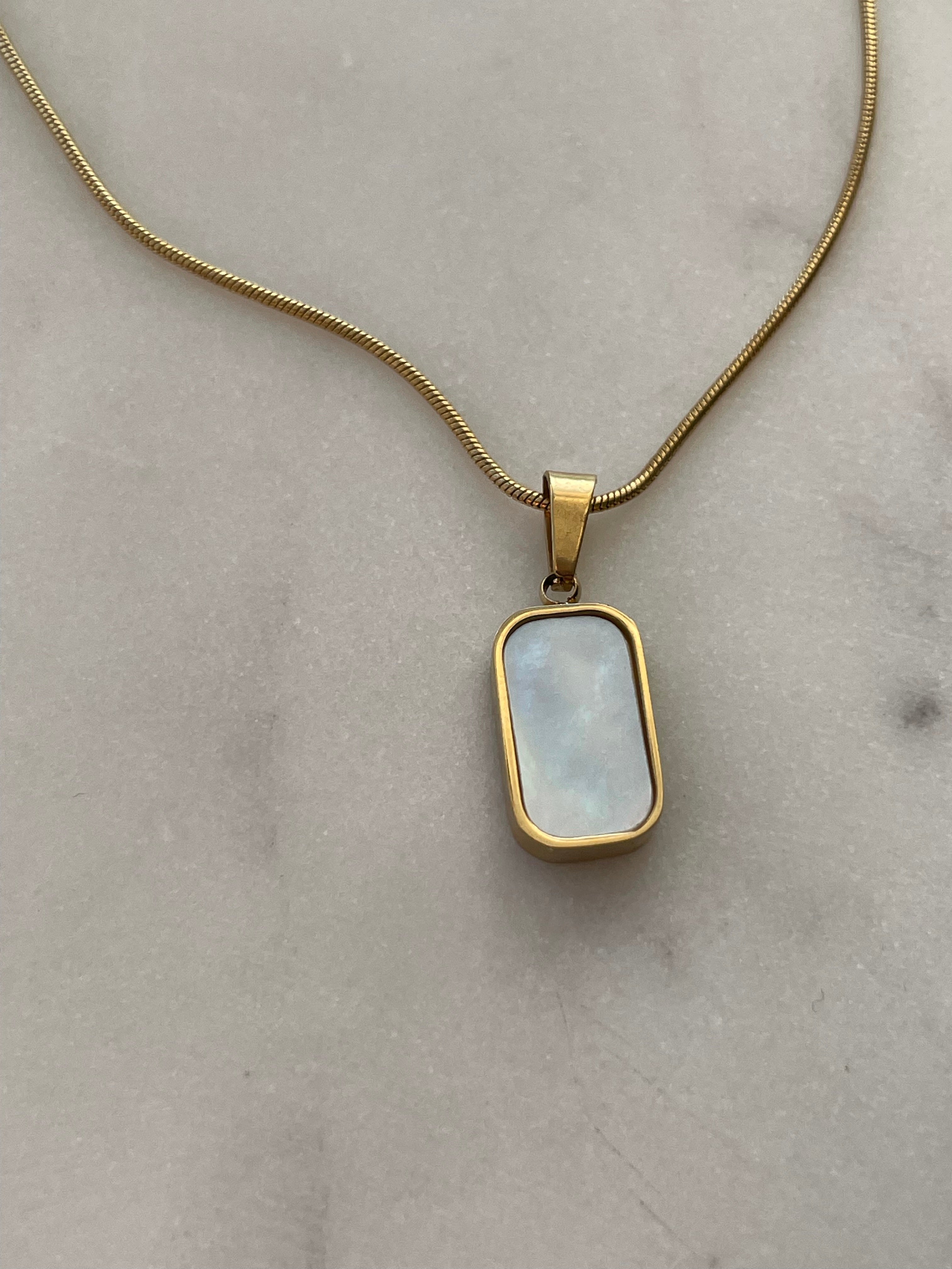 Golden Beauty: Necklace Pendant Stack for Every Look