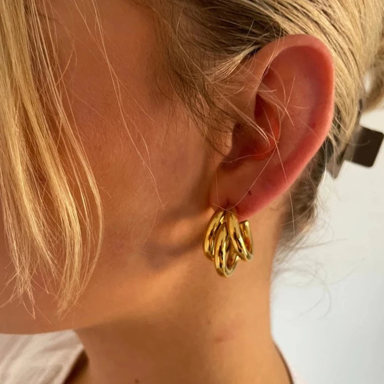 Triple Hoop Gold Earrings making a bold fashion statement