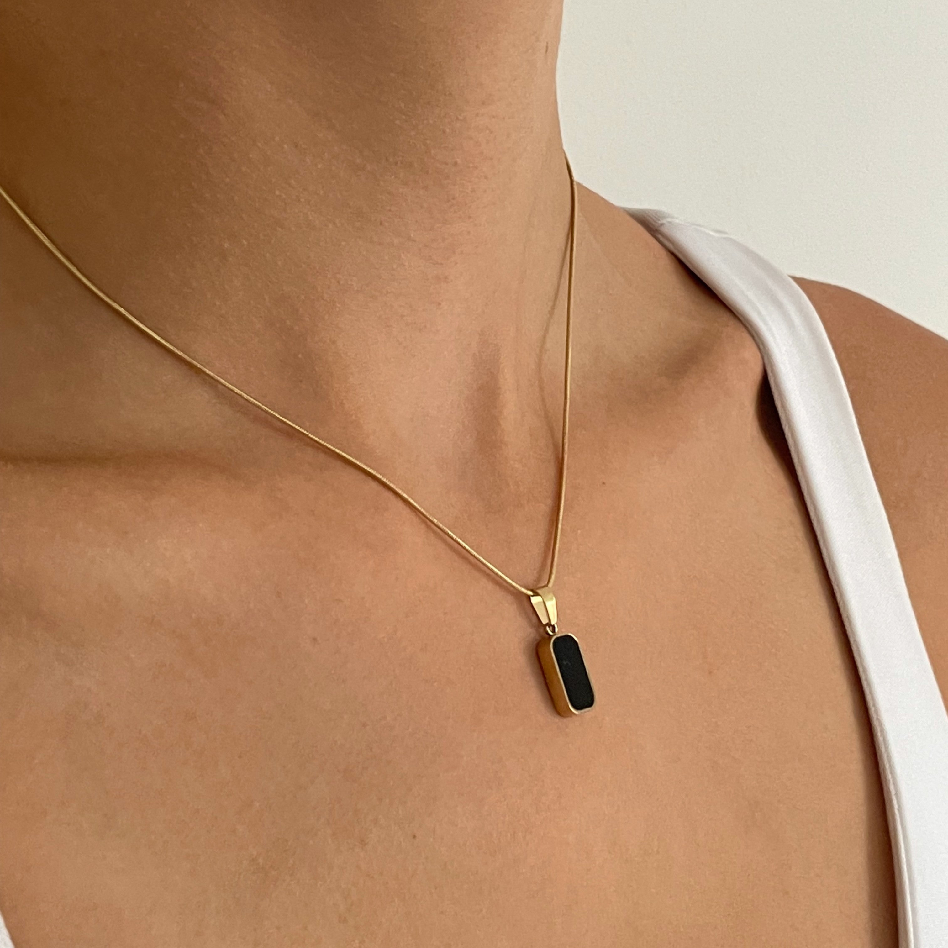 Illuminate Your Look: Gold Necklace Pendant Stack