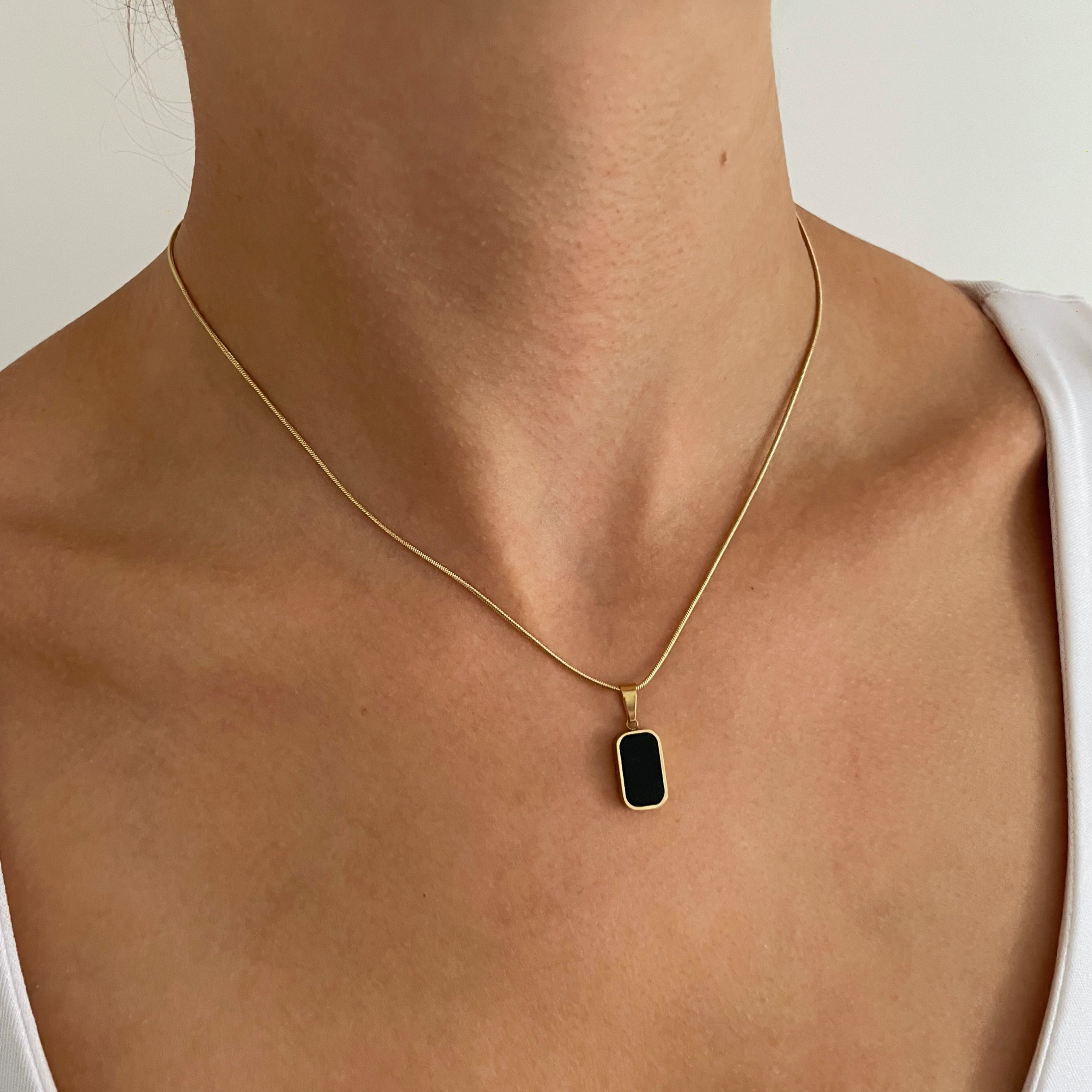 Radiate Confidence with a Gold Necklace Pendant Stack