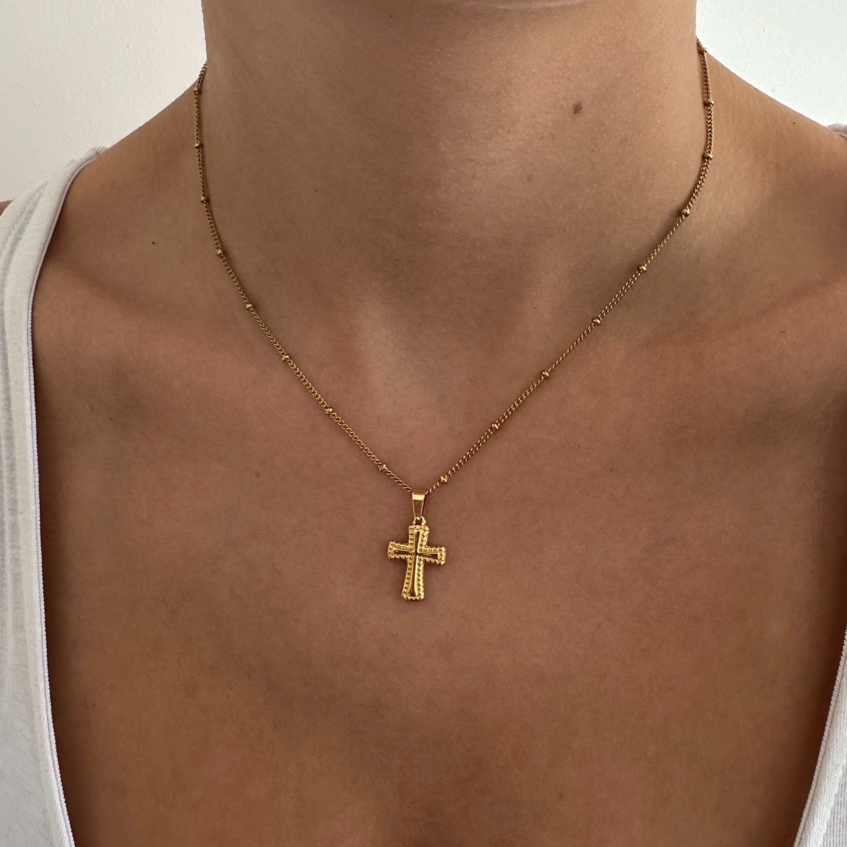 Gold Cross Pendant Necklace as a Symbol of Faith - Wear your beliefs with pride, adorned in this exquisite accessory.