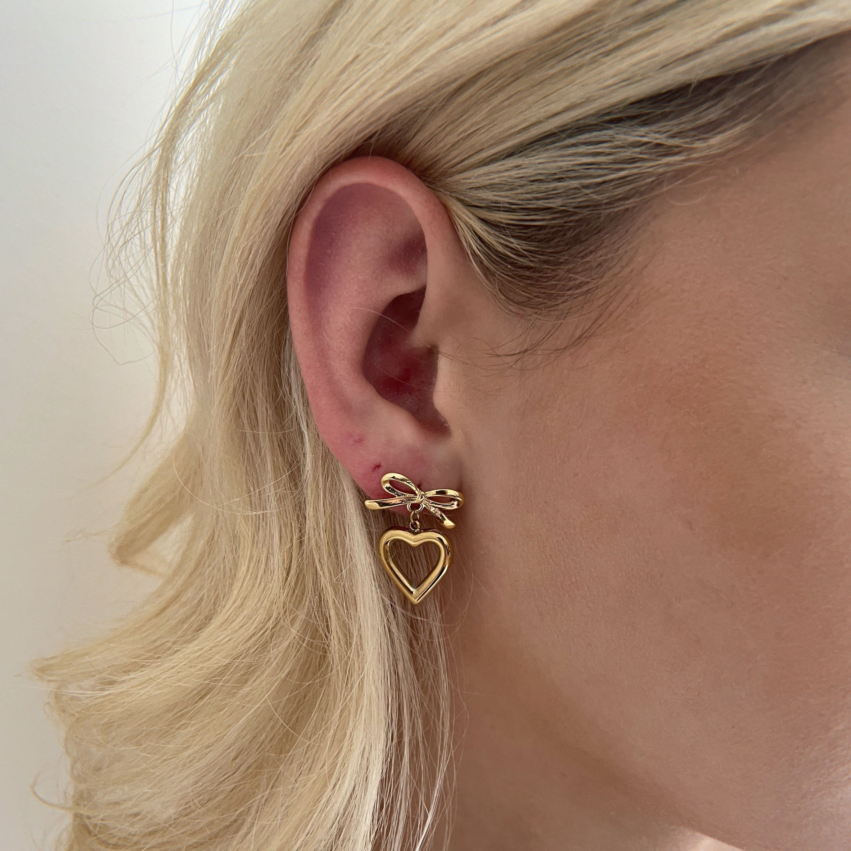 Gold Heart And Bow Earrings