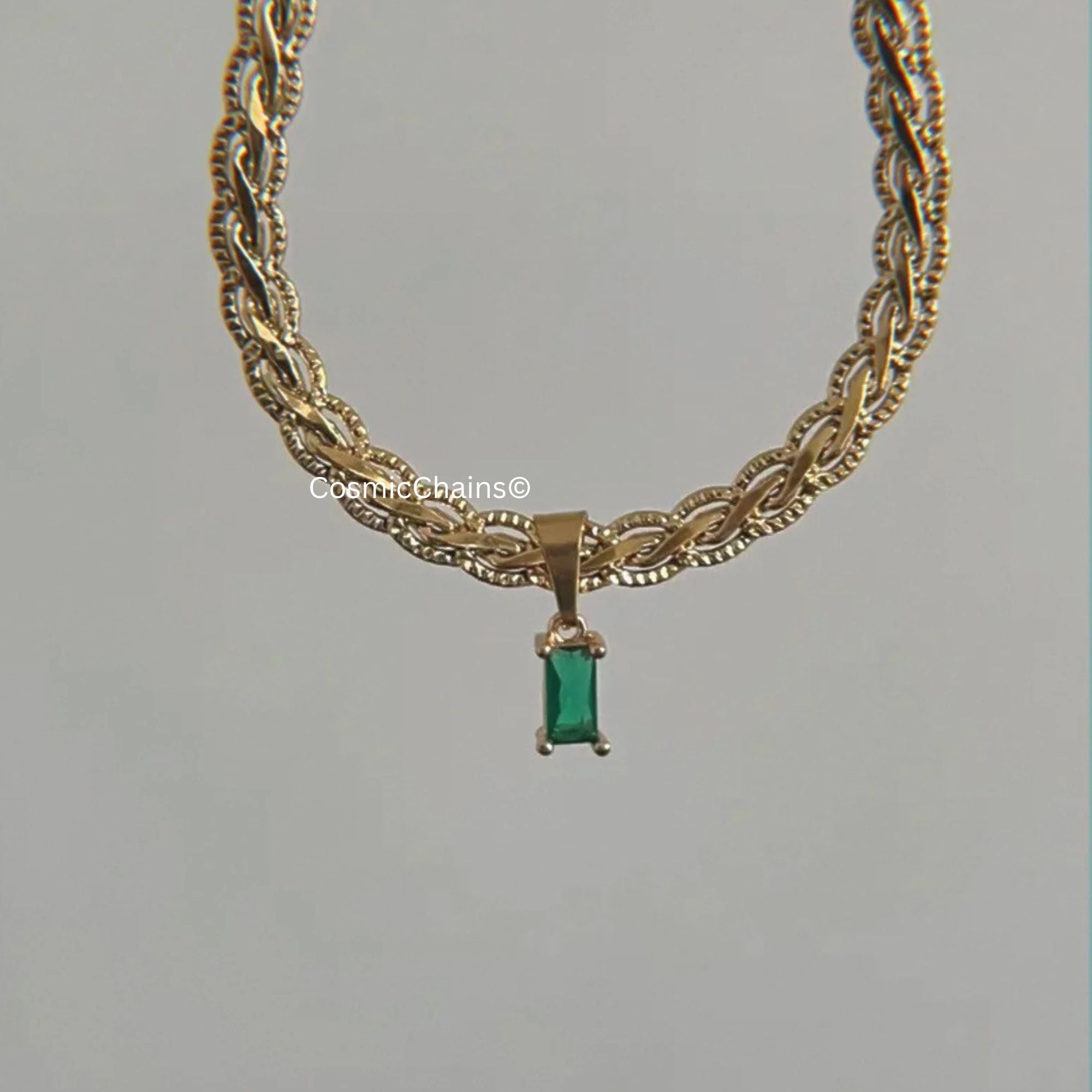 Chic gold necklace showcasing distinctive green rectangle charm 