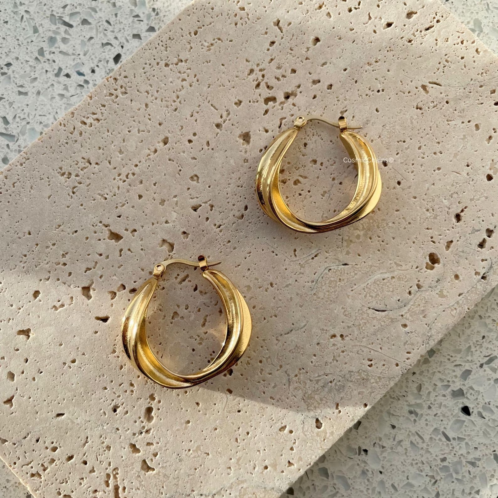 Turn heads with our exquisite chunky gold hoop earrings, the epitome of timeless fashion