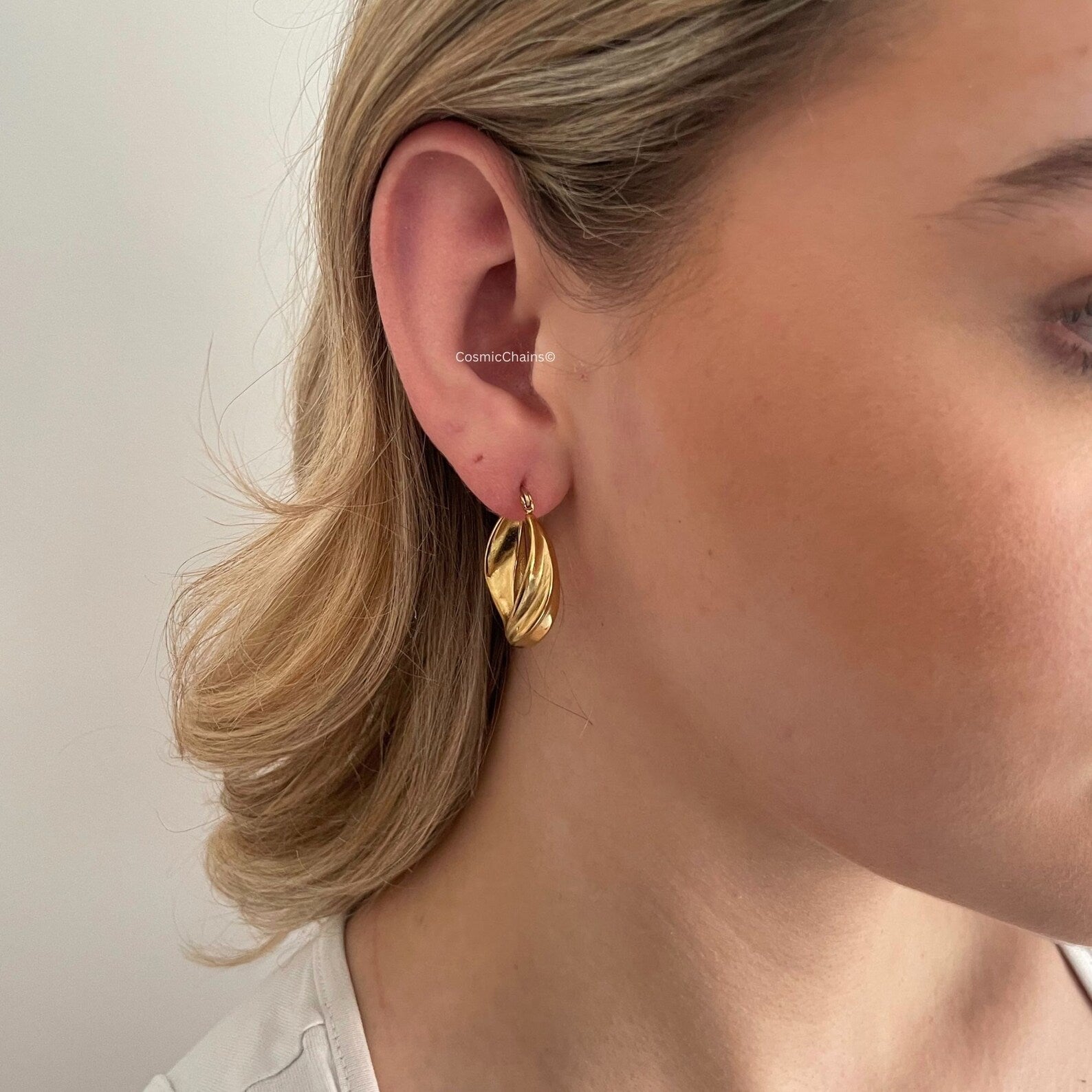 Elevate your ensemble with our chic chunky gold hoop earrings, a fashion essentials