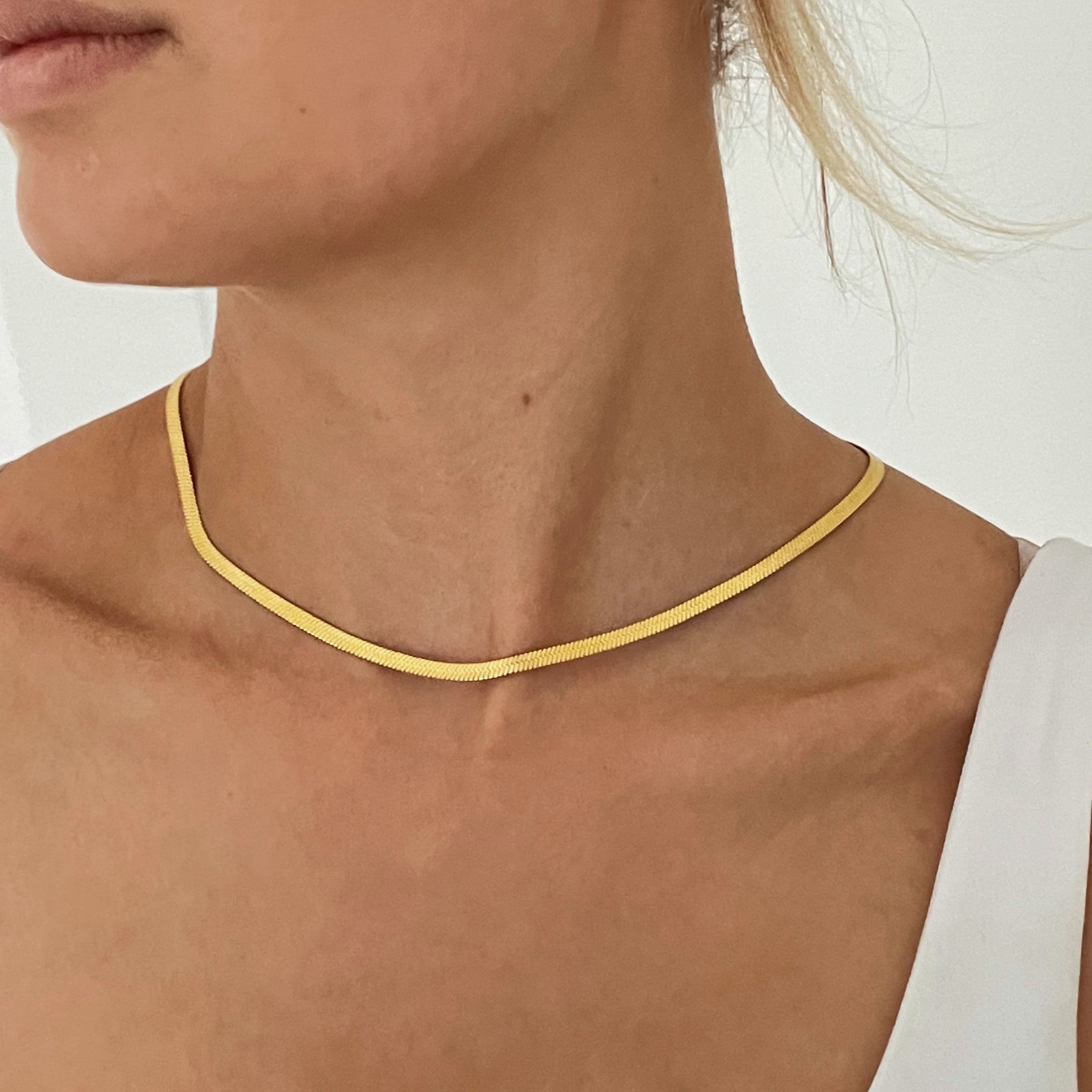 Trendy gold herringbone statement necklace
