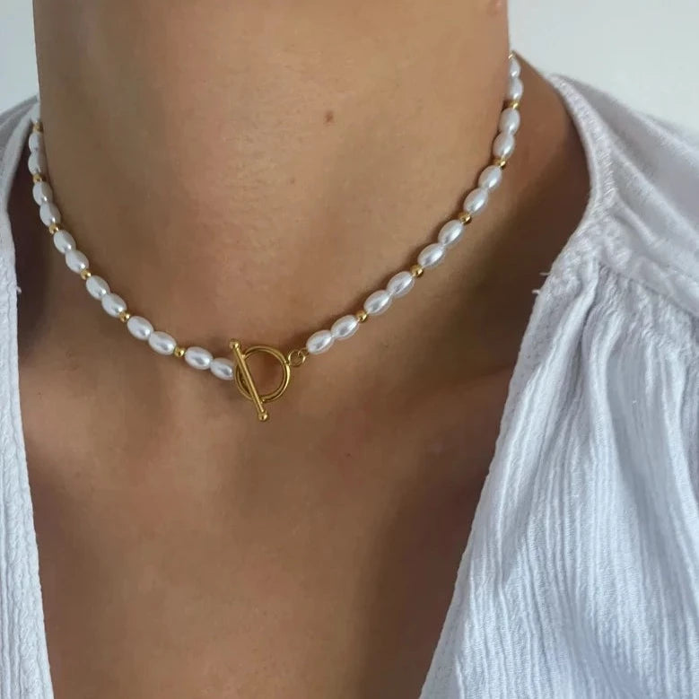 Make a statement with a gold and pearl necklace
