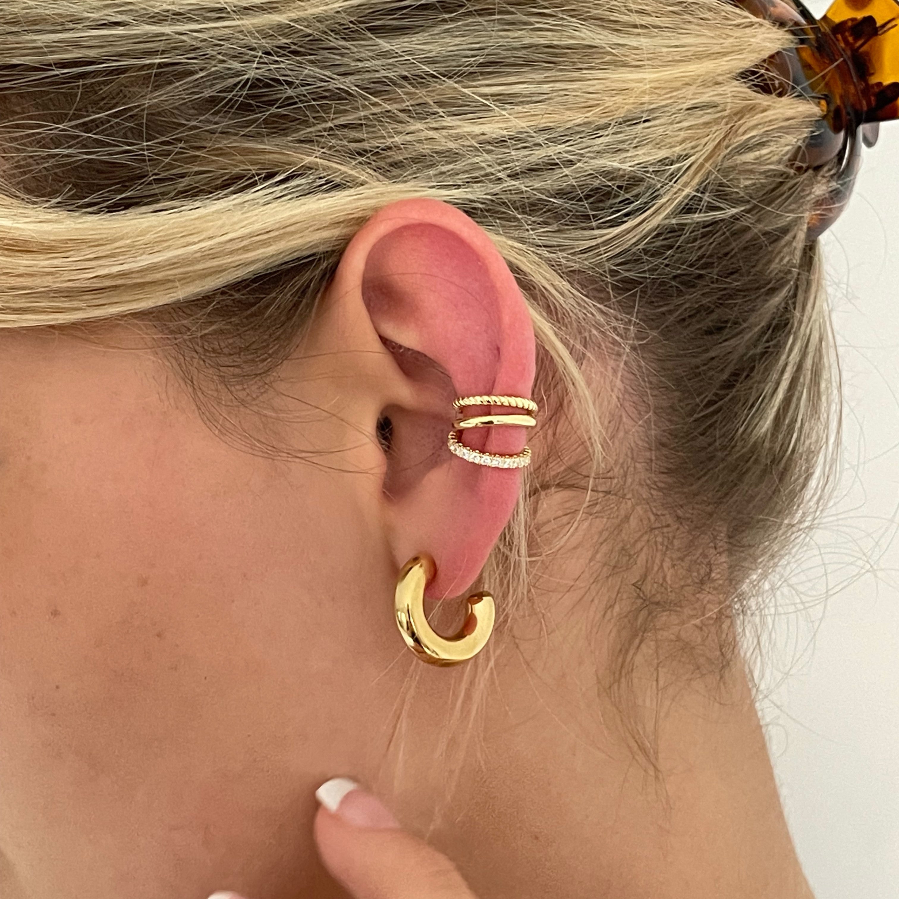 Small chunky gold hoop earrings, perfect for adding a touch of elegance to any outfit